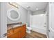 Bathroom featuring a vanity with a granite countertop, a round mirror, and a shower/tub combo at 229 Duchess Ct., Myrtle Beach, SC 29588