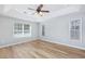 Neutral bedroom with tray ceiling, wood floors, and ample natural light through large windows at 229 Duchess Ct., Myrtle Beach, SC 29588