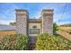 Entrance to Moss Estates featuring a brick sign surrounded by lush greenery at 229 Duchess Ct., Myrtle Beach, SC 29588