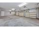 Spacious three-car garage with ample room for vehicles and storage with overhead lighting at 229 Duchess Ct., Myrtle Beach, SC 29588