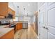 Open-concept kitchen with stainless steel appliances and wood-look flooring at 229 Duchess Ct., Myrtle Beach, SC 29588