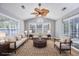 Cozy sun room filled with natural light, neutral furniture and views of the outdoors at 229 Duchess Ct., Myrtle Beach, SC 29588