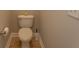 Standard, but clean toilet with brown tile flooring in a compact bathroom at 232 Palm Cove Circle, Myrtle Beach, SC 29588