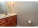 Bathroom with a wood vanity, countertop, sink, and fixtures at 232 Palm Cove Circle, Myrtle Beach, SC 29588