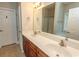 Bathroom with double sinks, wood vanity, large mirror, and walk-in shower at 232 Palm Cove Circle, Myrtle Beach, SC 29588