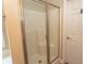 Bathroom featuring large shower with glass doors and white tiled walls at 232 Palm Cove Circle, Myrtle Beach, SC 29588