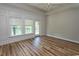 Inviting bedroom with hardwood floors, large windows, and access to outdoor space at 232 Palm Cove Circle, Myrtle Beach, SC 29588