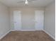 Bedroom featuring neutral walls, plush carpeting and dual closet doors at 232 Palm Cove Circle, Myrtle Beach, SC 29588