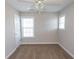 Cozy bedroom featuring neutral walls, plush carpeting, a ceiling fan, and bright windows at 232 Palm Cove Circle, Myrtle Beach, SC 29588