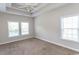 Bright bedroom features neutral carpet, ceiling fan, and generous natural light at 232 Palm Cove Circle, Myrtle Beach, SC 29588