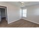 Bedroom features neutral walls, plush carpeting, a ceiling fan, and bright windows at 232 Palm Cove Circle, Myrtle Beach, SC 29588