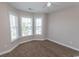 Bedroom featuring neutral walls, plush carpeting, and a bay window for natural light at 232 Palm Cove Circle, Myrtle Beach, SC 29588