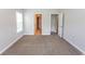Spacious bedroom with neutral tones, carpet, and ample natural light, and closet at 232 Palm Cove Circle, Myrtle Beach, SC 29588