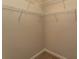 Walk-in closet with carpeted floor and multiple levels of wire shelving at 232 Palm Cove Circle, Myrtle Beach, SC 29588