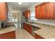 Well-equipped kitchen with stainless steel appliances, granite countertops, and wood cabinetry at 232 Palm Cove Circle, Myrtle Beach, SC 29588