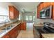 Bright kitchen with granite countertops, stainless appliances, and an open view to living area at 232 Palm Cove Circle, Myrtle Beach, SC 29588
