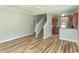 Bright living room boasts hardwood floors, staircase, and a glimpse of the kitchen at 232 Palm Cove Circle, Myrtle Beach, SC 29588