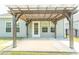 Covered patio with view to the backyard, featuring string lights and a concrete slab at 232 Palm Cove Circle, Myrtle Beach, SC 29588