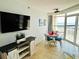 Comfortable dining area with ocean views, a flatscreen television and stylish furniture at 2404 N Ocean Blvd. # 635, Myrtle Beach, SC 29577