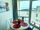 Inviting dining area with seating for four and serene ocean views from the large windows at 2404 N Ocean Blvd. # 635, Myrtle Beach, SC 29577