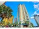 Exterior of condo building with palm trees, balconies, and ocean views against a clear blue sky at 2404 N Ocean Blvd. # 635, Myrtle Beach, SC 29577