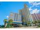 The Carolinian Beach Resort has beautiful architecture, landscaping, and great views of the blue sky and white clouds at 2404 N Ocean Blvd. # 635, Myrtle Beach, SC 29577