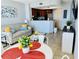 Bright condo living space with a neutral sofa, colorful pillows, and an open concept kitchen at 2404 N Ocean Blvd. # 635, Myrtle Beach, SC 29577