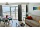 Bright and airy living space with large windows offering stunning ocean views and comfortable seating at 2404 N Ocean Blvd. # 635, Myrtle Beach, SC 29577