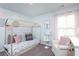 Cozy bedroom features stylish décor, a unique bed frame, and a soft color palette at 246 Mayflower Dr., Calabash, NC 28467