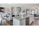Bright kitchen boasts granite countertops, stainless steel appliances, and a view of the dining area at 246 Mayflower Dr., Calabash, NC 28467
