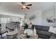 Inviting living room featuring a large sofa, decorative wall art, and seamless access to the open concept kitchen at 246 Mayflower Dr., Calabash, NC 28467