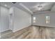 Spacious bedroom with hard wood floors, neutral walls, a ceiling fan, and large windows at 250 Mayflower Dr., Calabash, NC 28467