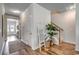 Hallway featuring hardwood floors, stairs, storage, and natural light at 250 Mayflower Dr., Calabash, NC 28467