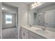 Bright bathroom featuring double sink vanity, large mirror, and modern fixtures at 261 Mayflower Dr., Calabash, NC 28467