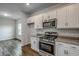 Well-equipped kitchen with stainless steel appliances and granite countertops at 261 Mayflower Dr., Calabash, NC 28467