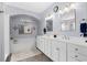 Elegant bathroom with double vanity, mirrors, and soaking tub at 274 Avenue Of The Palms, Myrtle Beach, SC 29579
