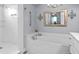 Bright bathroom features soaking tub with white marble surround and chrome fixtures at 274 Avenue Of The Palms, Myrtle Beach, SC 29579