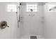 Modern bathroom boasts marble-style tiled walk-in shower at 274 Avenue Of The Palms, Myrtle Beach, SC 29579