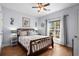 Comfortable bedroom with a beautiful wooden bed frame, matching nightstands, and stylish ceiling fan at 274 Avenue Of The Palms, Myrtle Beach, SC 29579