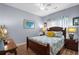 Cozy bedroom with hardwood floors, ceiling fan, and matching nightstands at 274 Avenue Of The Palms, Myrtle Beach, SC 29579