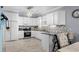 Modern kitchen with stainless steel appliances, white cabinets, and tile backsplash at 274 Avenue Of The Palms, Myrtle Beach, SC 29579