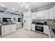 Bright kitchen featuring white cabinets, stainless steel appliances, and an eat-in counter at 274 Avenue Of The Palms, Myrtle Beach, SC 29579