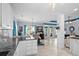 Open-concept kitchen flows into dining area with tile floors and modern finishes at 274 Avenue Of The Palms, Myrtle Beach, SC 29579