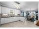 Contemporary kitchen with white cabinetry, tiled backsplash, and stainless steel appliances at 274 Avenue Of The Palms, Myrtle Beach, SC 29579