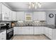 Well-lit kitchen featuring white cabinetry, stainless steel appliances, and granite countertops at 274 Avenue Of The Palms, Myrtle Beach, SC 29579
