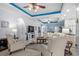 Spacious living area with armchairs, coffered ceilings, decorative lighting, and fireplace at 274 Avenue Of The Palms, Myrtle Beach, SC 29579