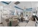 Open-plan living area with comfortable seating, accent rug and tiled flooring under coffered ceilings at 274 Avenue Of The Palms, Myrtle Beach, SC 29579