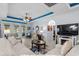 Comfortable living room showcasing a fireplace, tiled floor, and coffered ceilings with beautiful light fixtures at 274 Avenue Of The Palms, Myrtle Beach, SC 29579