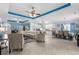 Expansive living area featuring tiled floor, open floor plan, and coffered ceilings with decorative lighting at 274 Avenue Of The Palms, Myrtle Beach, SC 29579