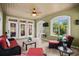 Inviting sunroom featuring tiled floors, comfortable seating, and large windows for ample natural light at 274 Avenue Of The Palms, Myrtle Beach, SC 29579